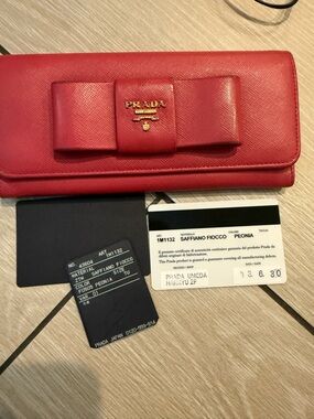Preloved Prada Saffiano Bow Continental Wallet in Peonia can be woc
